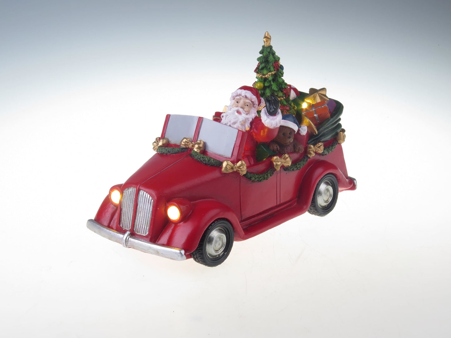 Santa in car with turning tree